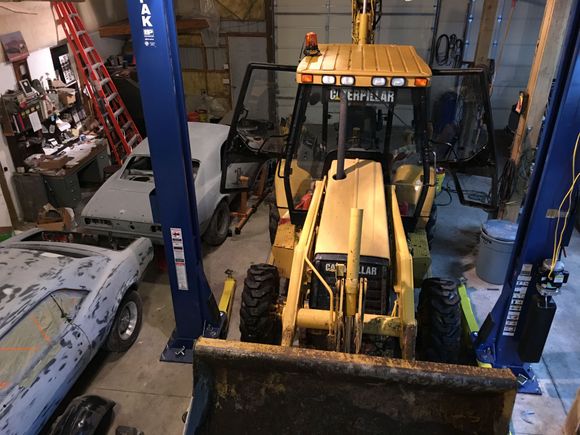 This picture gives some scale to the shop, the boom on the tractor is 12' tall, and the 67 and 68 Camaros