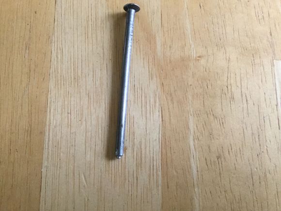 The nail will Make a perfect depression in the center of the rivet.