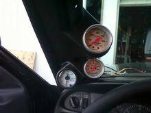 tri pod gauge.  I did not want 3 gauges going up the pillar, so I took a single pod and cut it down to sit on the side of my double pod cluster.  A little plastic glue, paint, and wow it looks great!!