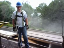 Me standing on a railcar while it is being loaded with corn.