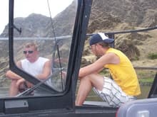 Me and my cousin Tim on the front of this flat bottom boat goin fishin down Snake River in Montana.
