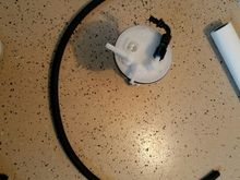 -6AN hose next to new fuel pump housing modified for Walbro 450LPH