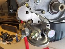 After bolting on the oil filter housing, I used a breaker bar to take off the two oil plugs on each side to replace with oil fittings.  The right sized allen socket and breaker bar gets these loose without any heat.  This is done so I can have an oil source for my oil pressure gauge and one for my turbo.  One of these is post filter for the turbo.   I also installed a new oil pressure sending unit.  I used high temp thread sealant on everything instead of yellow teflon tape.