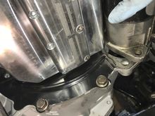 Starter against oil pan
