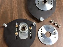 Upper bearing plates modified for strut tower pinch bolt clearance.