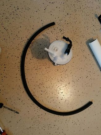 -6AN hose next to new fuel pump housing modified for Walbro 450LPH