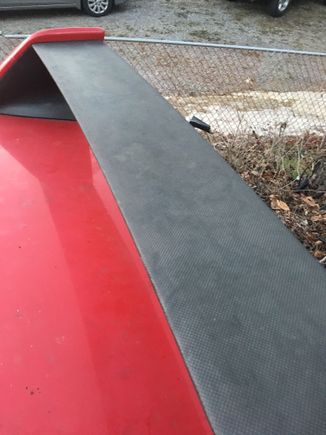 Carbon fiber on spoiler has typical clear coat peel