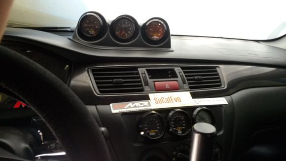 I have 6 Analog AEM Gauges. I can see them while driving pretty much.