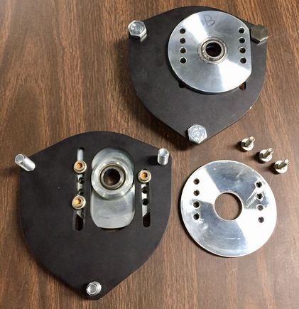 Upper bearing plates modified for strut tower pinch bolt clearance.