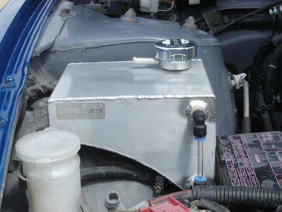Nifty aluminum coolant tank, to replace Nissan's plastic crap that consistently corrodes and cracks.