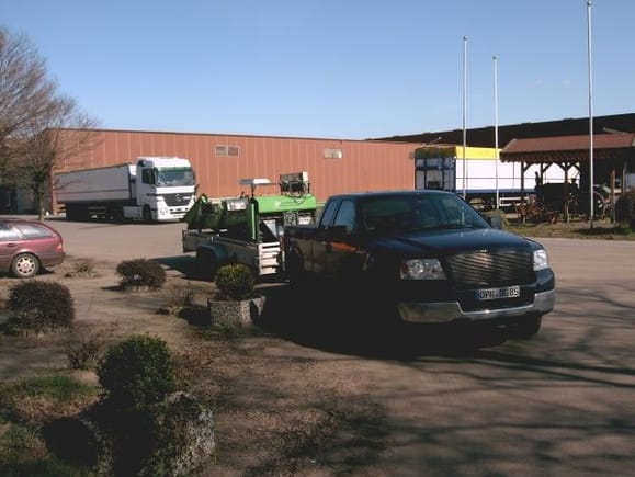 truck and trailer loaded with the seed potato cutting machine