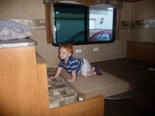 My littlest one exploring the dinette bed