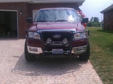 Front end with brush guard and fog lights