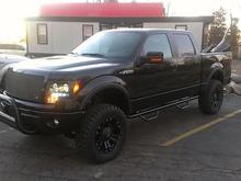 Side View.  Nerf Bars, 6" Pro Comp Suspension Lift Kit, XD Blacked out Wheels, Pro Comp Xterrain Tires