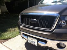 Plasti Dipped the grill and emblem and then used glossifer on it.