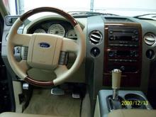 New Steering wheel and leather shifter cover.