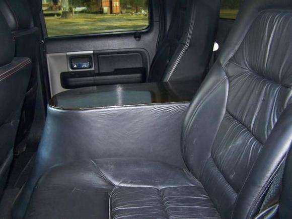 custom leather bucket seats and fiberglass center console with 2 12's