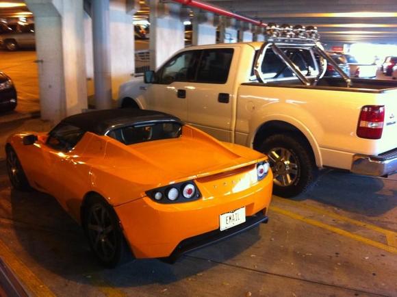 Parked next to a Tesla