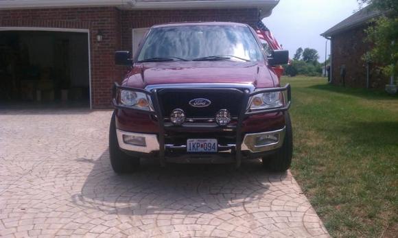 Front end with brush guard and fog lights