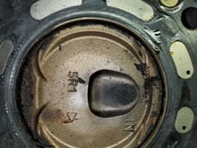 Closeup of one piston.  Interesting little dots in the head gasket where more flow could be happening on the water around the jackets.  Anybody know what that's about?