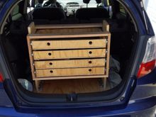 Toolbox that I definitely should have designed with solid 5ply sides and a full back panel (and the soft close drawer slides. Those springs would have kept me from needing to put a strap around the drawers). Was trying to use scrap n save wood for the ramp.