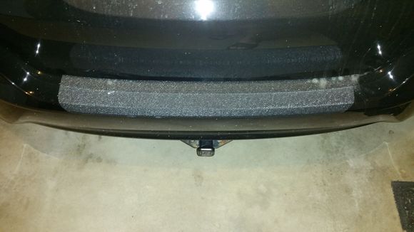 Aftermarket rear bumper appliqué.