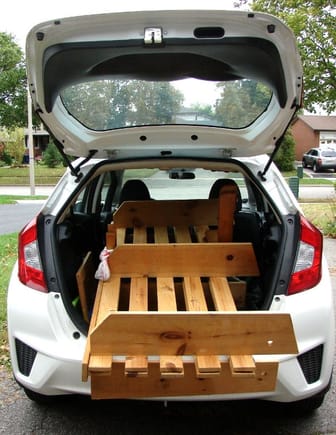 2016 Honda Fit hauling a double size futon frame, 6' long 35" wide, 20" deep. Hatch could not close.