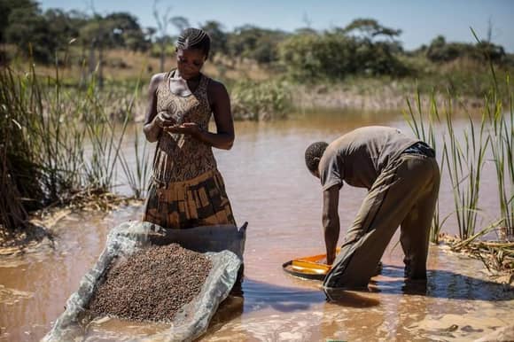 Getty Images/ separating cobalt from mud and rocks in DR Congo