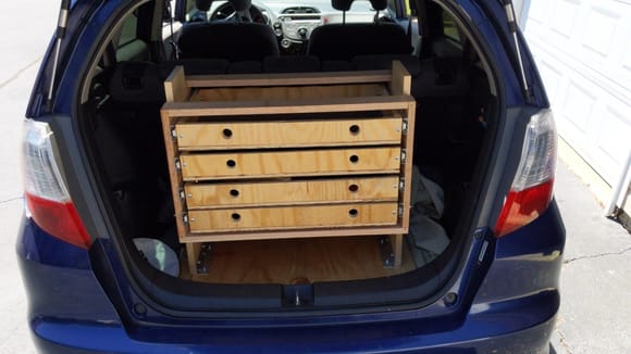 Toolbox that I definitely should have designed with solid 5ply sides and a full back panel (and the soft close drawer slides. Those springs would have kept me from needing to put a strap around the drawers). Was trying to use scrap n save wood for the ramp.