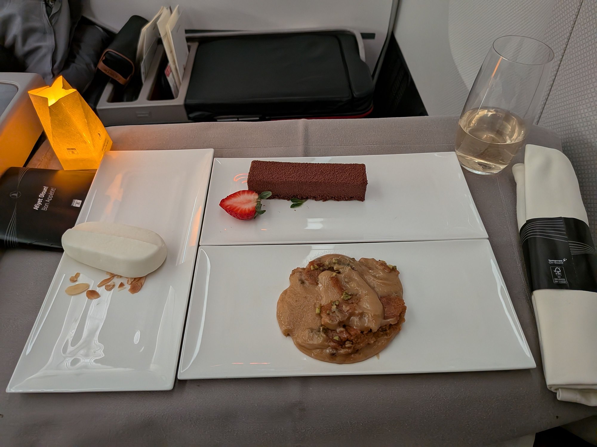 I asked for whatever desserts the very friendly cabin crew member recommended. Glad I did as the halwa was not on my radar. He pointed to the halwa as he served it and seemed genuinely excited to say that it was his favorite. It was indeed very very good. The ice cream was a bit on the frozen side but it was fantastic to mix into the warm halwa. Trifle was fine, but overshadowed by the halwa.