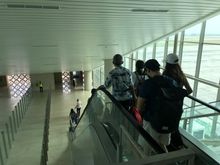 When to board the aircraft, you'll go 1 level down by elevator  or escalator