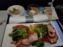 Chicken tikka with yogurt, salad, and pomegranate seeds. The small dish tasted of a tuna pate. Lemon something with graham crumble topping. Roasted peeled almonds in the bag.