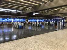  After dropping off my car, I made the 6 minute walk over to the terminal. I started to head to the checkpoint but was busted for not sending my bag through Ag inspection; I thought that was only for checked bags. 