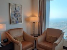 Very comfortable armchairs beside the bed. Arrow at top of ceiling pointing in direction of Mecca