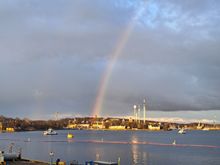 Rainbow ( faint double) from Slussen waterfront in late evening after a passing shower