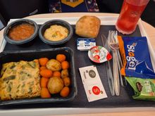 Clockwise from top left: fruit compote, fish paste with sweetcorn and peas, (regular bun from the basket), Nordic Blush, crackers, sesame sweet thing, salt and pepper (woo!), omelette kind of square with potatoes and carrots. 