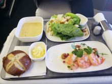 Lemongrass Ginger Prawns with fennel salad, roasted cashews, pomegranate seeds, and wasabi mayonnaise; Little Gem Caesar Salad with shaved parmesan cheese, pretzel croutons, and caesar dressing; Thai Coconut Soup