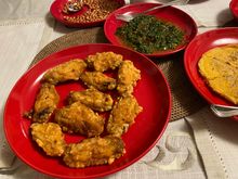 Fried chicken wings , kang kong ( water spinach / water convolvulus ) , fried peanuts & onion omelette 