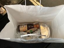 Delivered in a white paper bag, which I love over the plastic bags. 