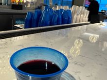 Nothing beats red wine in a blue plastic cup… B6 lounge. No glassware available. 