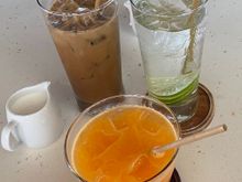 Robust Vietnamese iced coffee , iced tangerine juice and water