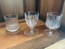 The suite has 3 different glasses whilest the standard room had only the tumbler.