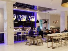 Bar and restaurant area with breakfast to the right side beyond