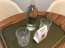 Complimentary bottled water and QR-code for roomservice