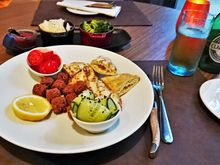 Vegan On request, falafel, bread, and garnments.