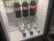 Mini fridge in room with free drinks