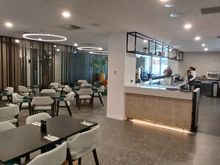 Bar area access from front foyer, leading into the dining area.