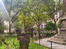 Tombstones in the peace and quiet of the grounds surrounding the Trinity Church, just steps away from the 9/11 Memorial 