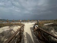 The beach is very narrow, only a few meters from the dunes to the water.