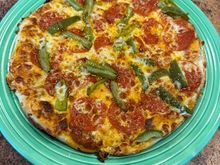 I came across a recipe for “skillet pizza,” made stove top in a caste iron skillet. I “cheated” slightly by putting it under the broiler for about a minute to brown the cheese. Looks prettier than it tasted, but not bad. 